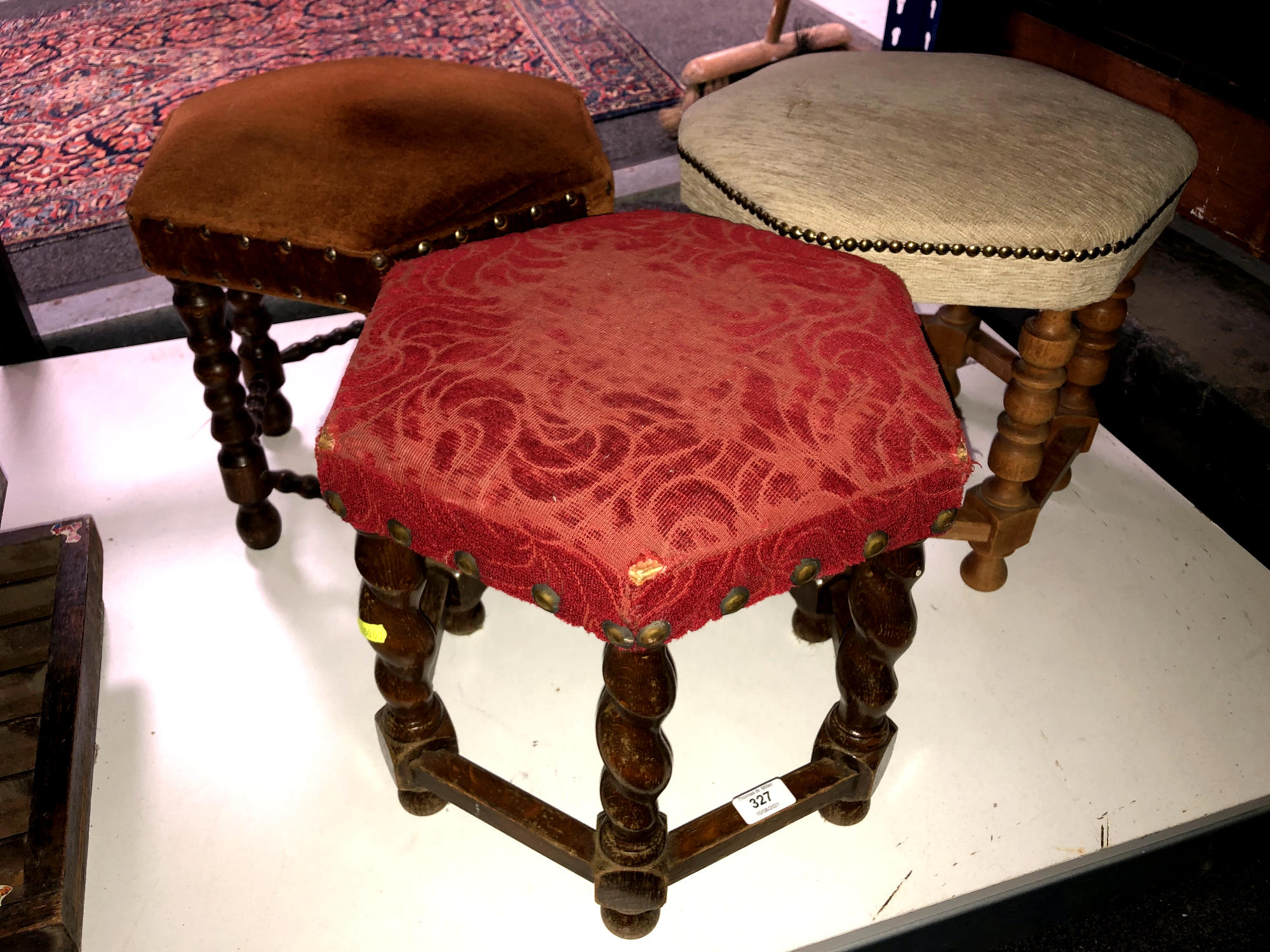 Three hexagonal upholstered footstools