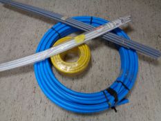 Two rolls and two bundles of plastic tubing