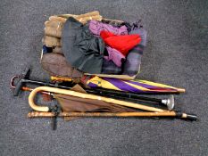 A box containing a quantity of gloves, woolen scarf, two pairs of waterproof trousers,