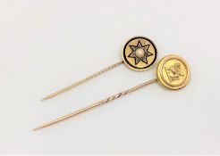 Two gold stick pins; one depicting a sphinx,