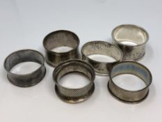 Six assorted silver napkin rings CONDITION REPORT: 72.