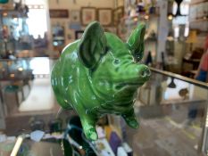 A rare Wemyss pottery green pig circa 1900.