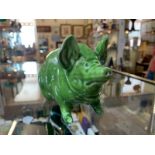 A rare Wemyss pottery green pig circa 1900.