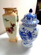 A blue and white oriental style lidded vase together with an antique English transfer patterned vase