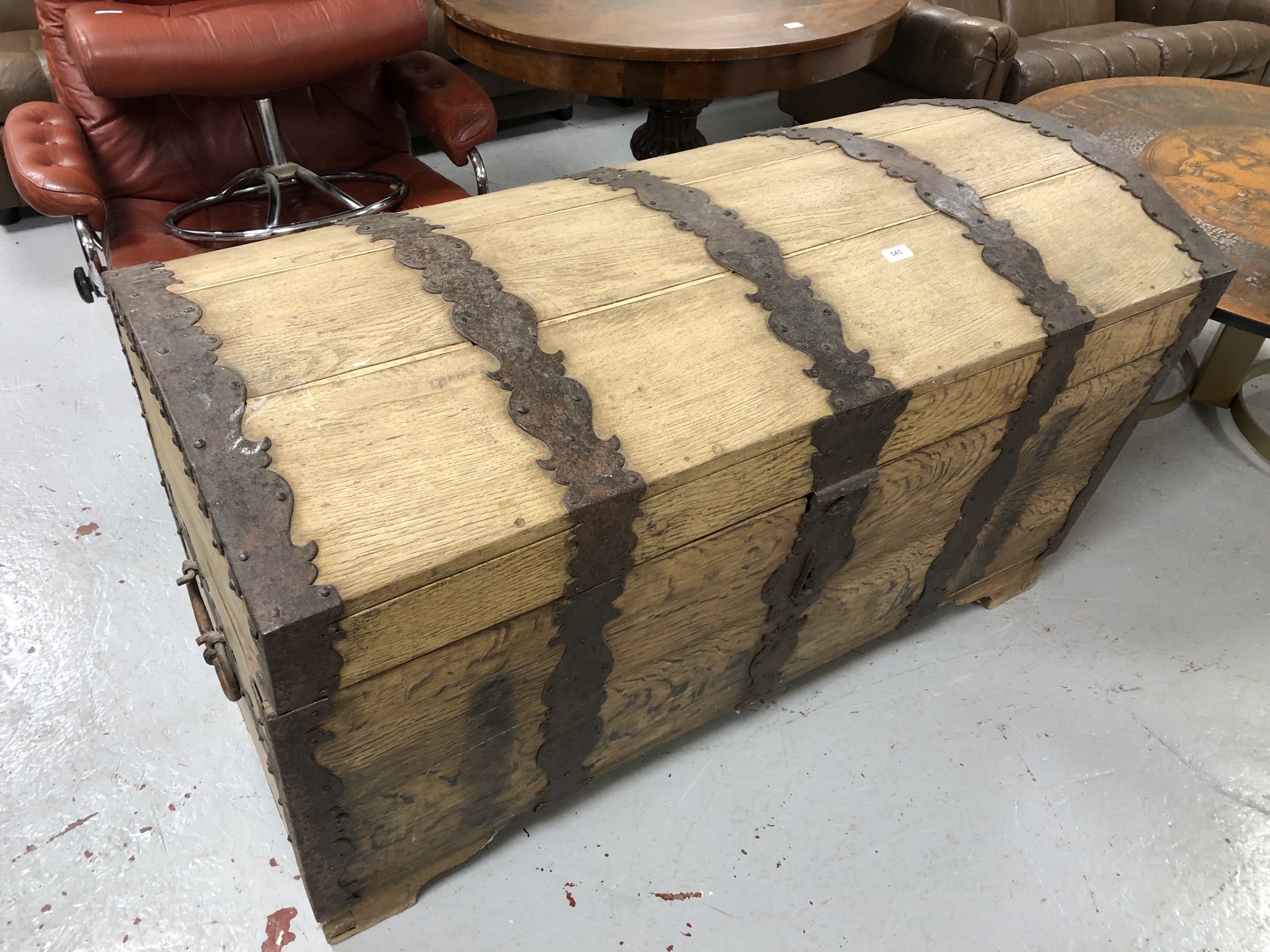 A nineteenth century oak and metal bound dome topped trunk