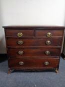 A George III inlaid mahogany chest of five drawers