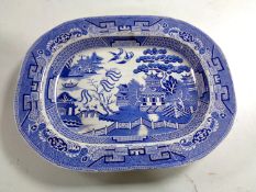 An early 19th century blue and white willow pattern meat plate by Hulme and Booth
