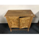 A Continental oak double door side cabinet