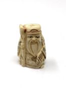 A carved Chinese bone netsuke -Elderly Gentleman with staff