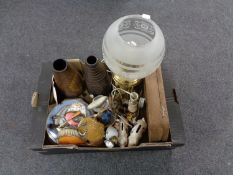 A box of brass table lamp, piggy banks, pottery vases, tea china, dressing table brushes,