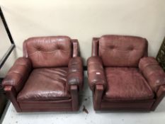 A pair of twentieth century Burgundy leather armchairs