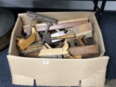 A box containing a very large quantity of woodworking planes and other carpentry tools