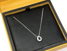 A 9ct white gold diamond and sapphire pendant on chain,