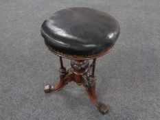 A late Victorian ornate carved revolving piano stool (as found)