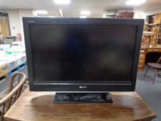 A Sony Bravia 32 LCD TV with remote and lead