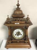 An Edwardian walnut eight day mantel clock with enamelled dial