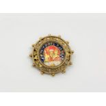 An antique 18ct gold and enamel brooch 'S M V PAUL RAINER', 7.4g, diameter 32 mm.