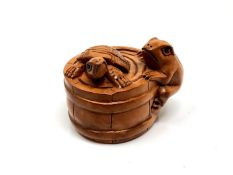 A carved Chinese hardwood netsuke - Turtle and frog in barrel