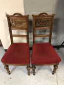 A pair of Continental carved oak dining chairs