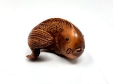 A carved Chinese hardwood netsuke - Carp