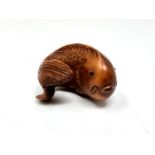 A carved Chinese hardwood netsuke - Carp