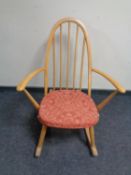 An Ercol elm and beech spindle backed rocking chair