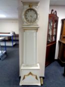 A continental painted and gilt long case clock with pendulum and one weight