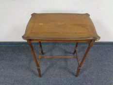 An Edwardian inlaid mahogany occasional table