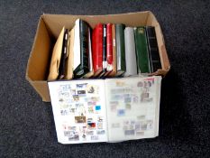A box containing a very large quantity of stamps in albums,