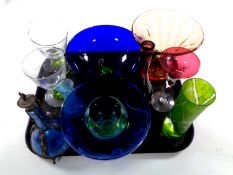 A tray containing a quantity of 20th century coloured glassware including bowls,