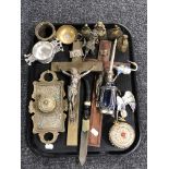 A tray of crucifixes, brass bells, desk stand,