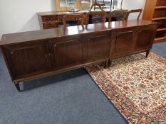 A continental mahogany triple door sideboard with matching double door sideboard