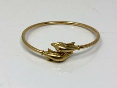 A 14ct gold dolphin bangle CONDITION REPORT: 7.5g.