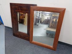 A hardwood mirror together with a further framed bevelled mirror