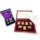 A collection of silver gilt stamps in two boxes.