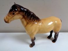 A Beswick Highland horse.