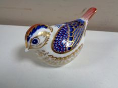 A Royal Crown Derby goldcrest paperweight with gold stopper.