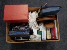 A box of miscellany to include oriental plate and ornament, cased cutlery, travel set, books,