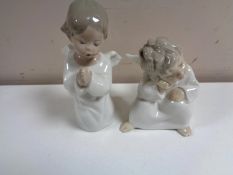 Two Lladro figures of cherubs.