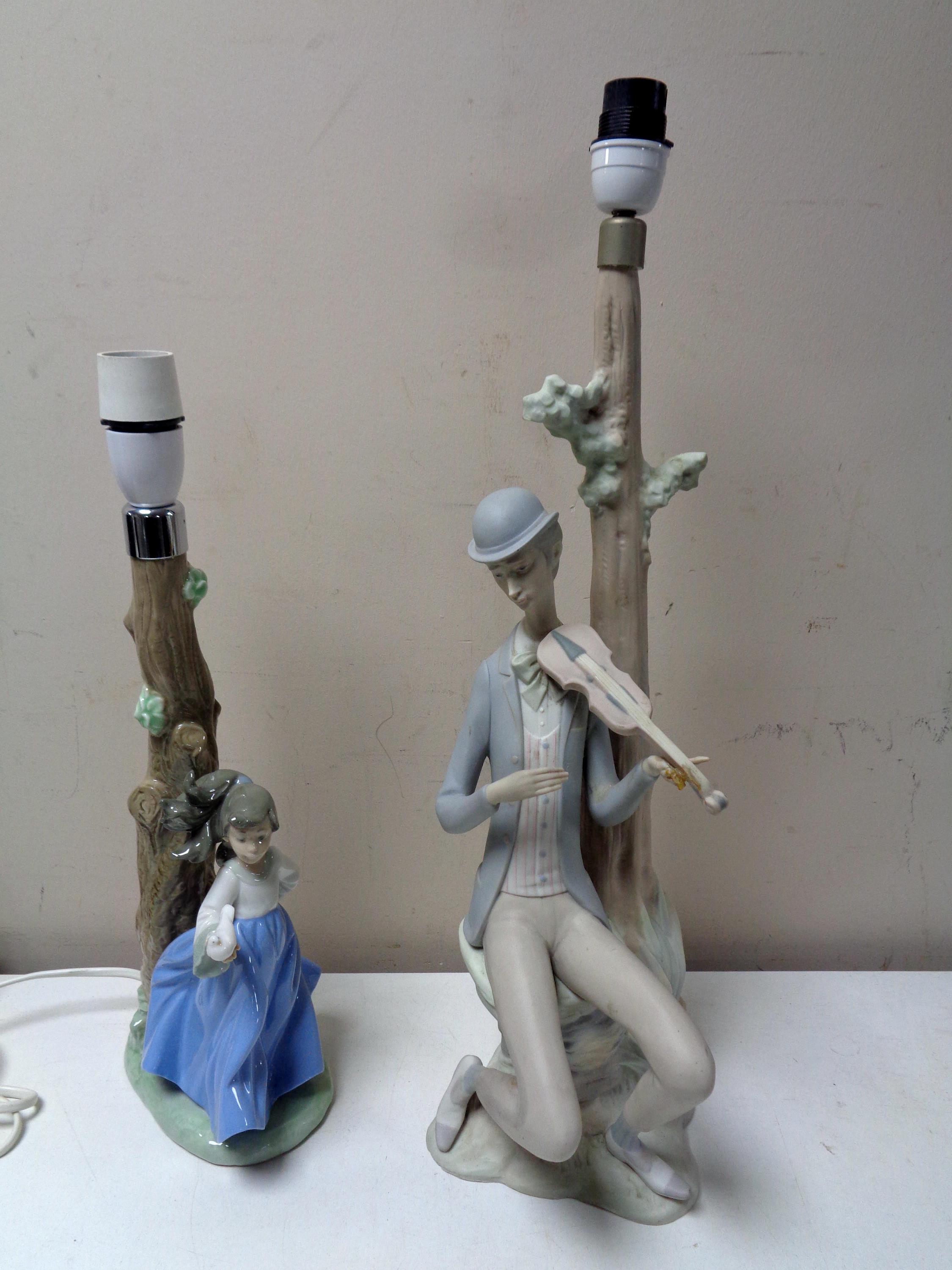 A Nao figural table lamp 'Girl with bird' together with a further Spanish table lamp 'Man with