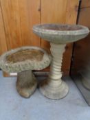 Two concrete bird baths