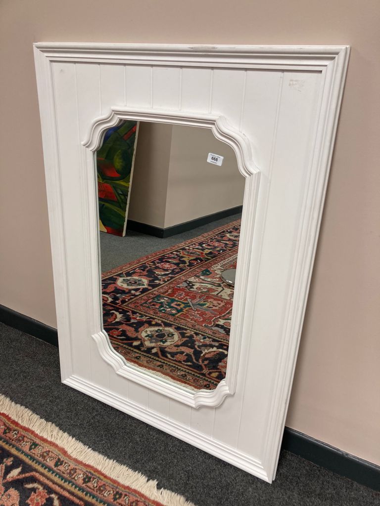 A 3' x 2' white framed mirror
