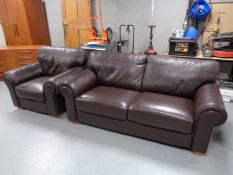 A brown leather two seater settee with matching armchair CONDITION REPORT: Settee: