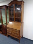 An Edwardian mahogany bureau bookcase