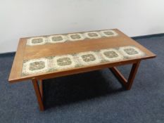 A 20th century Danish teak tile top coffee table