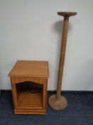 A teak effect audio cabinet together with a torchere