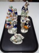 A tray of seven Staffordshire flat back figures