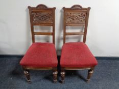 A pair of early 20th century carved oak dining chairs