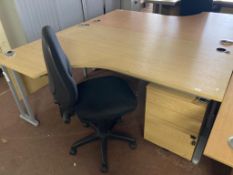 A light oak effect desk, width 180 cm, together with three drawer pedestal and black swivel chair.