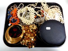 A tray of costume jewellery to include beaded necklaces, assorted lady's wristwatches,